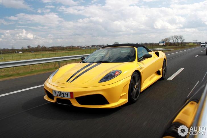 Yellow Ferrari Scuderia Spider 16 in the middle of an exclusive combo
